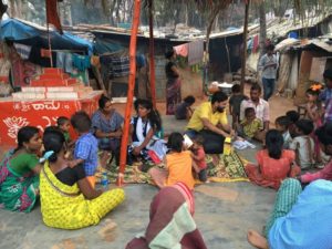 Raghu in the community in Bangalore slum Pollinate Group